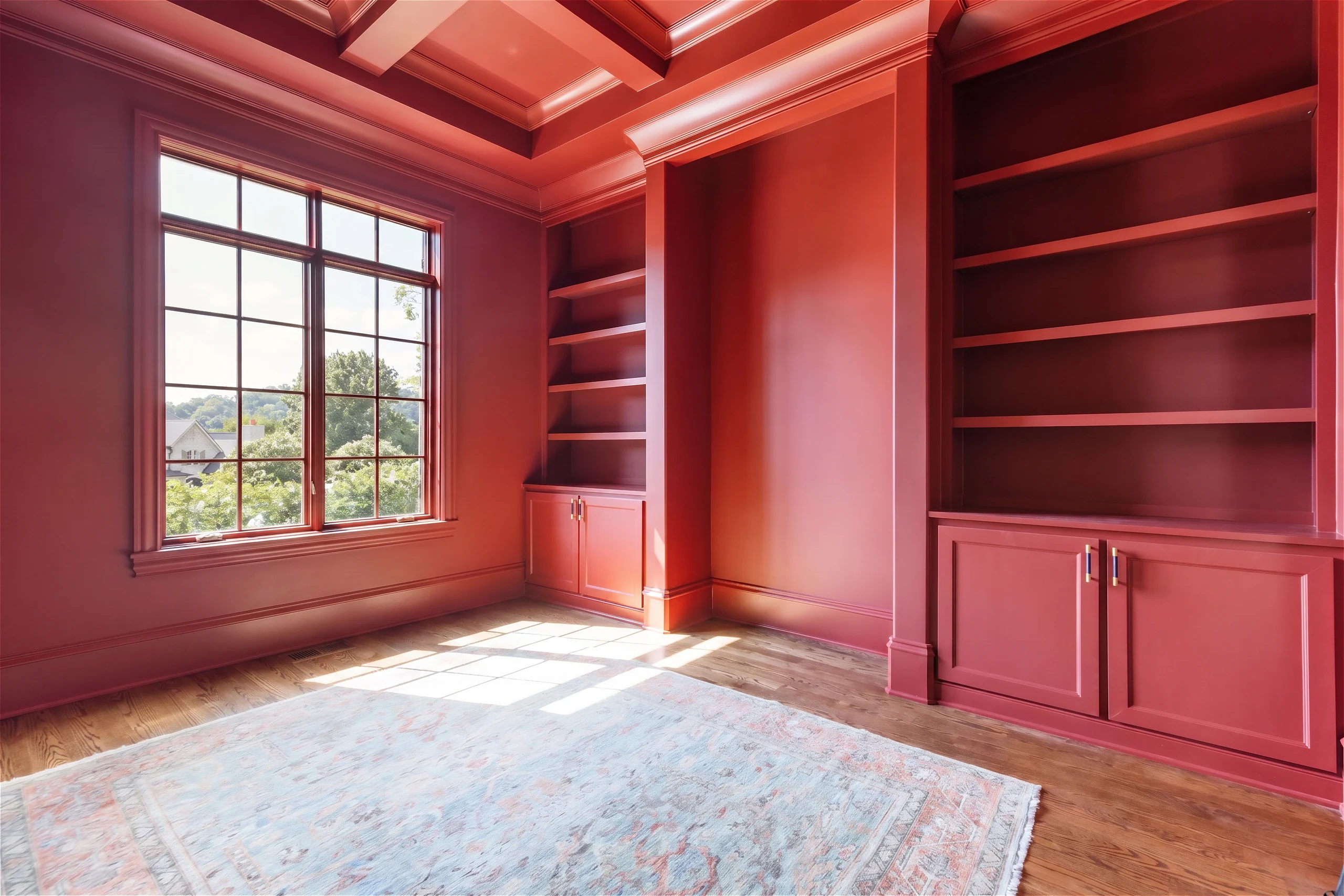 Deep red paneled room with matching built-in shelves and a coffered ceiling